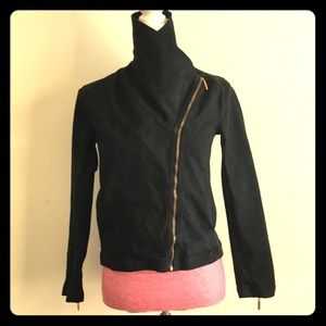 Black Jacket, with golden zipper.